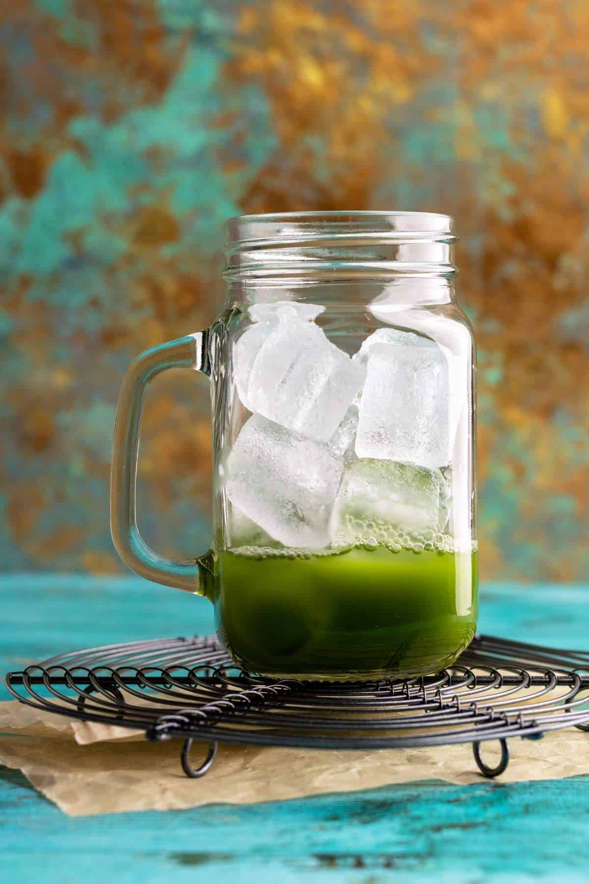 Ice cubes in a jar with matcha.