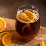 Espresso tonic with an orange slice.