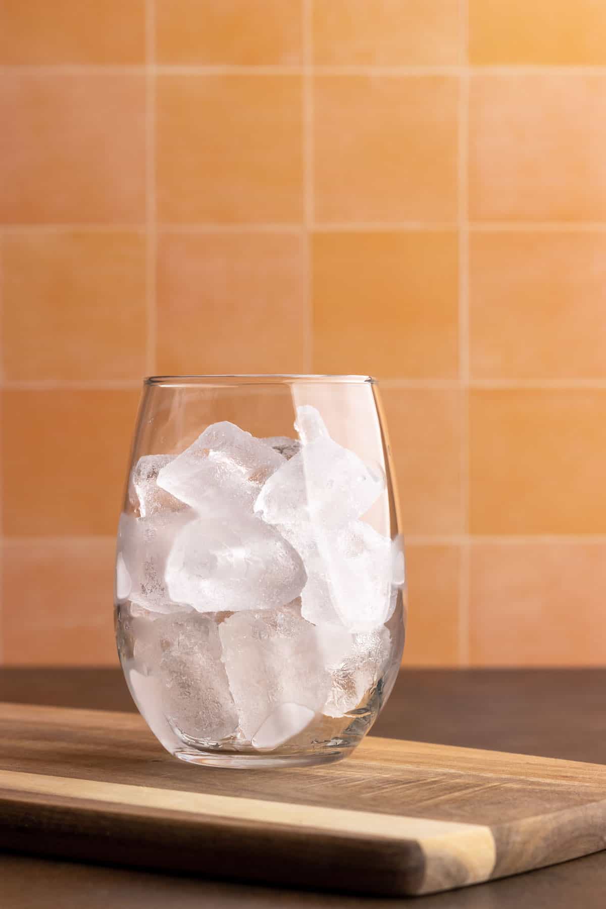 Glass filled with ice cubes.