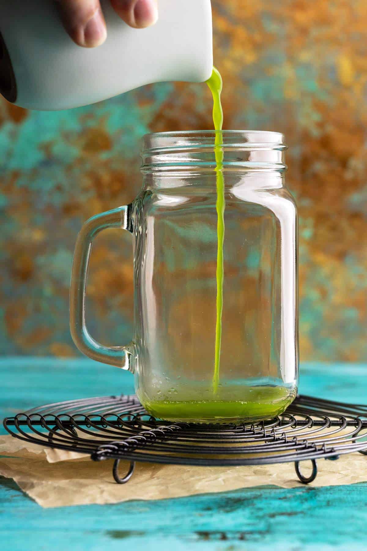 Pouring matcha into a jar.