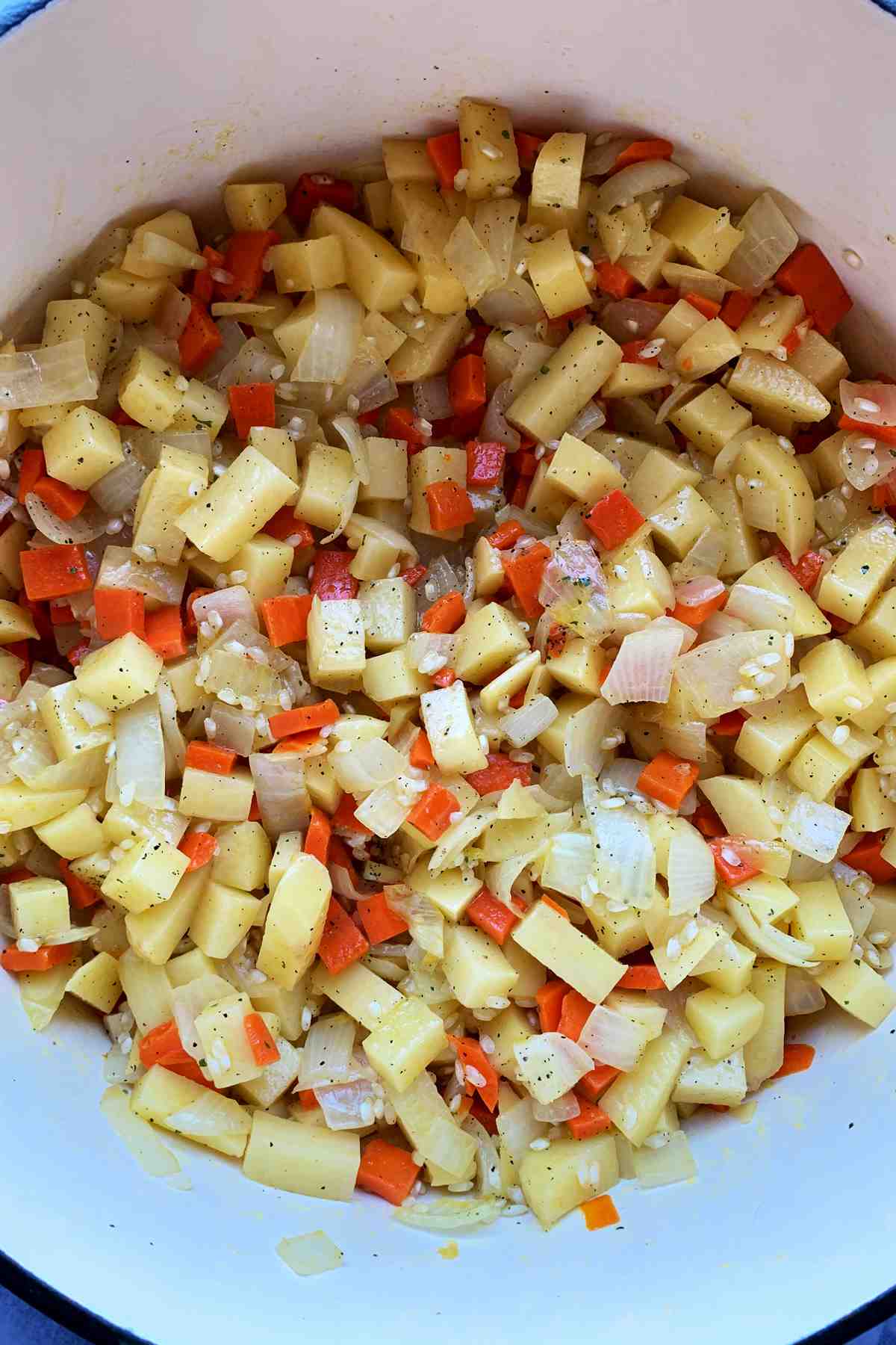 Chopped vegetables in dutch oven.