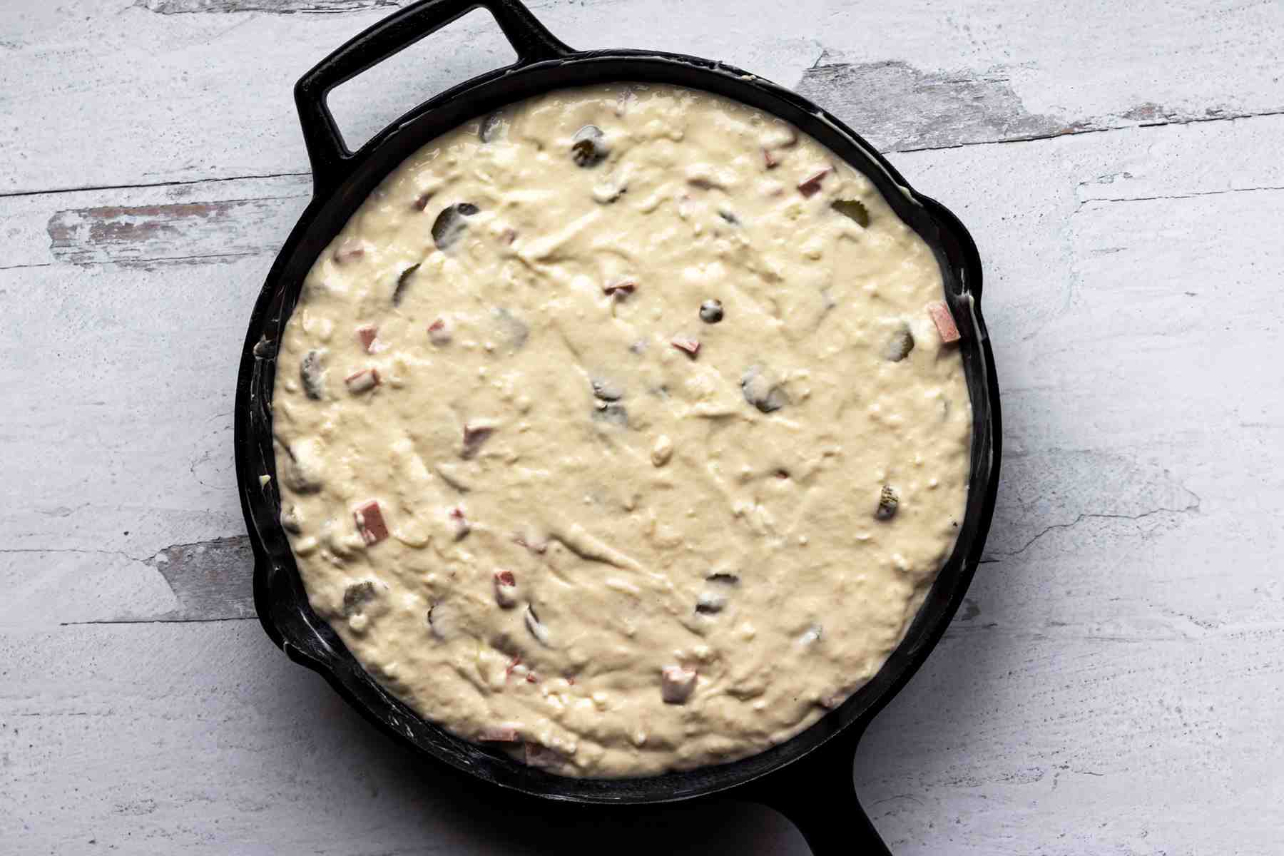 Ham and cheese quiche in cast iron skillet.