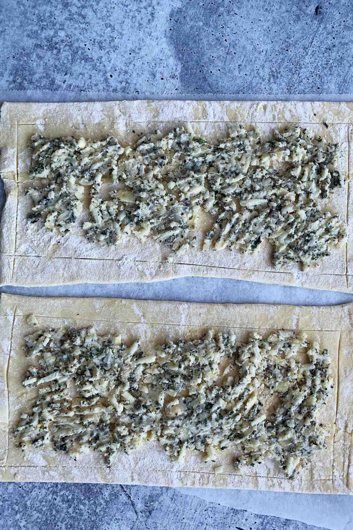 Puff pastry flatbread with garlic butter spread.