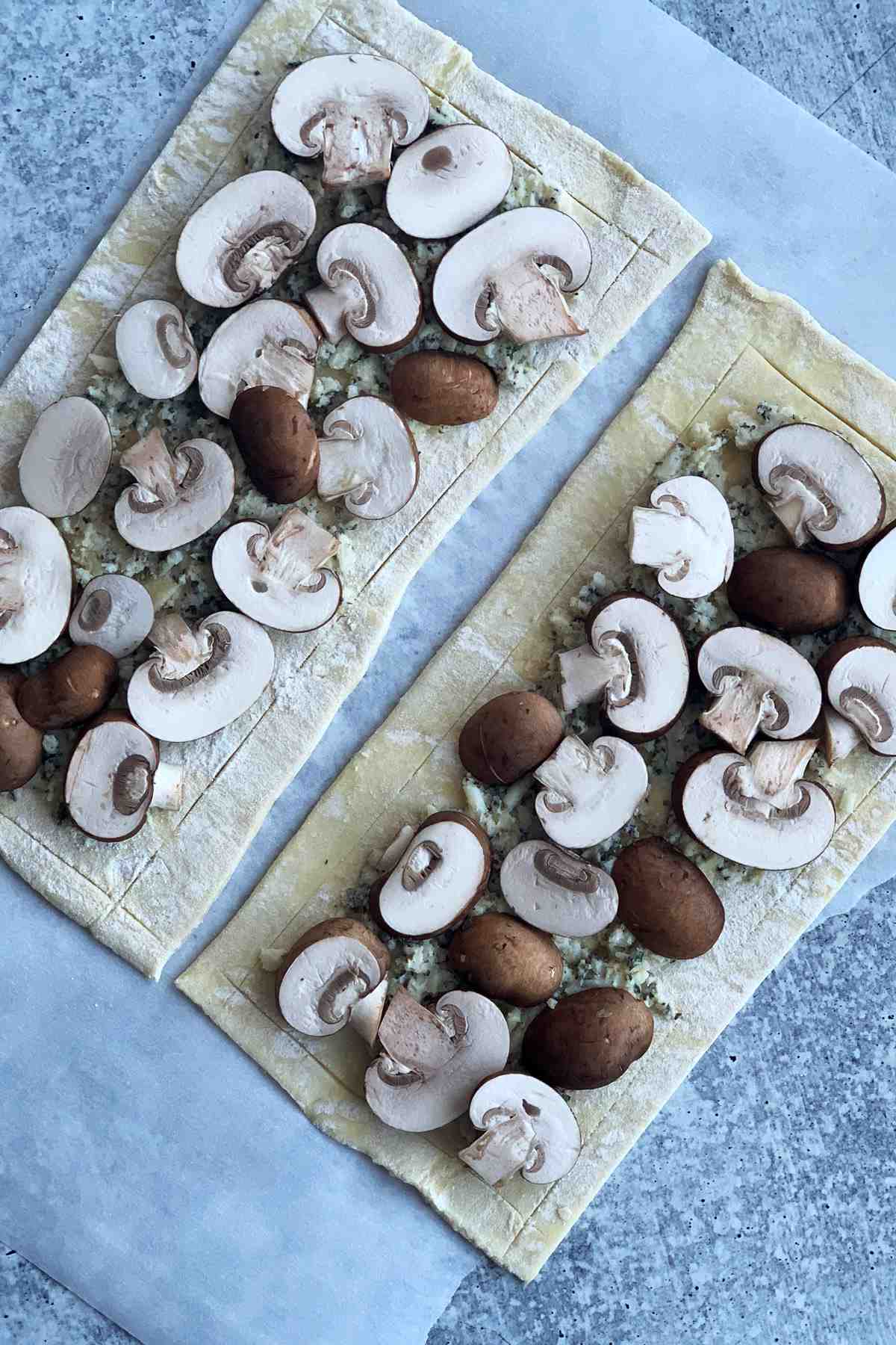 Puff pastry with mushrooms on top.