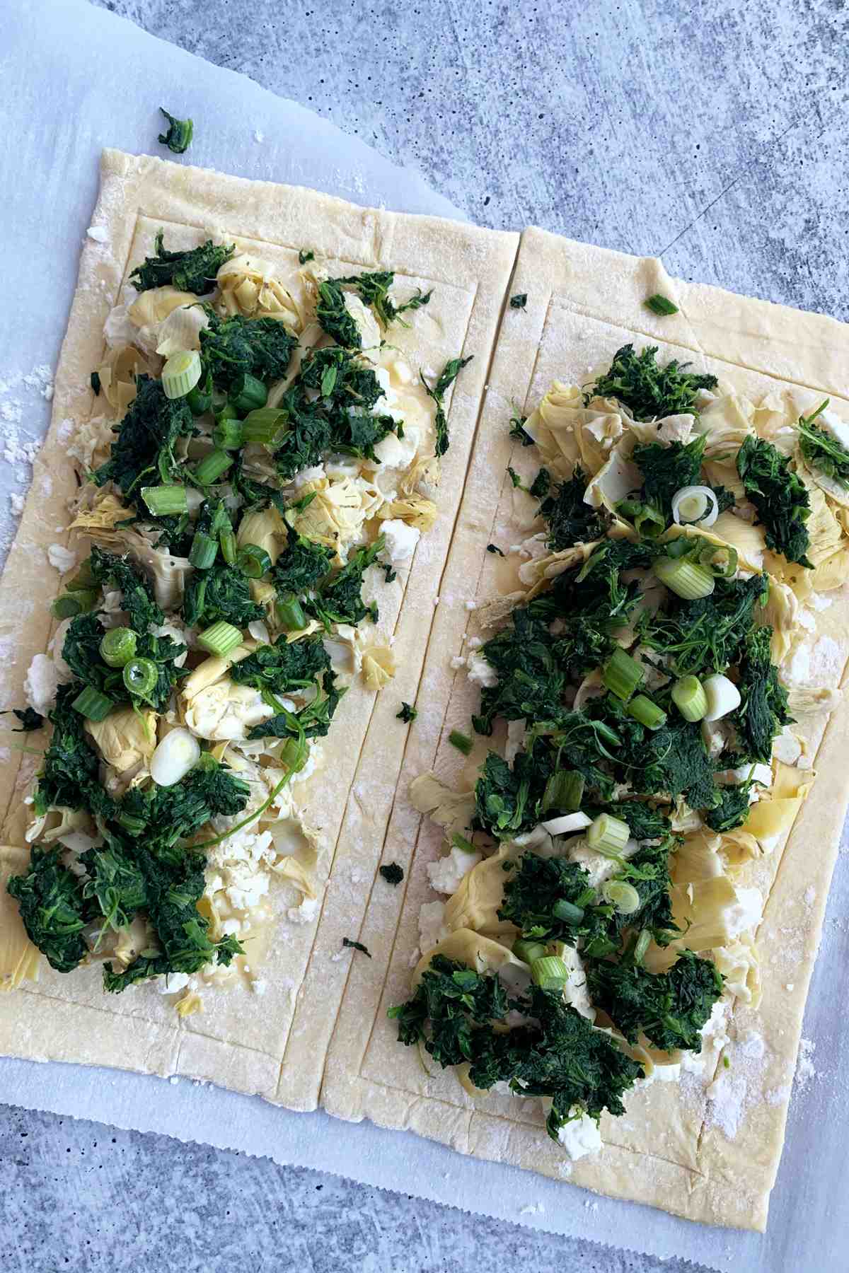 Puff pastry flatbread with spinach and cottage cheese.