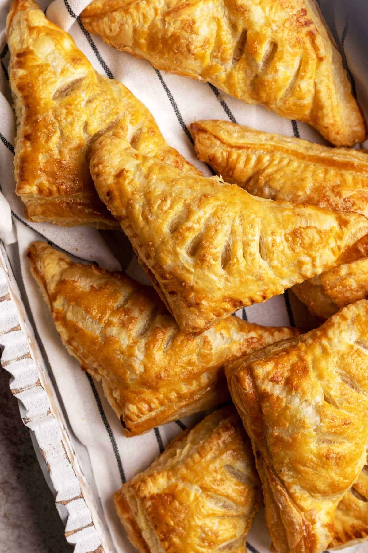 Apple turnovers in a serving tray.