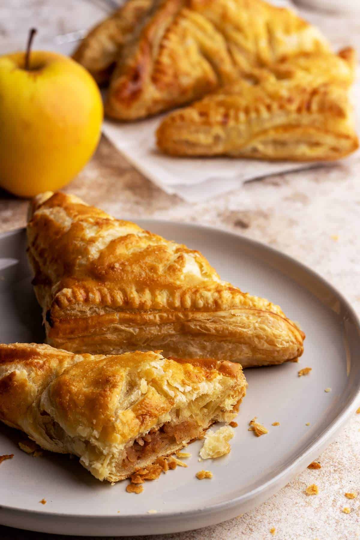 Apple turnovers on a plate.