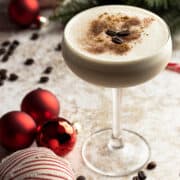 Bailey's espresso martini in a coupe glass with garnishes.