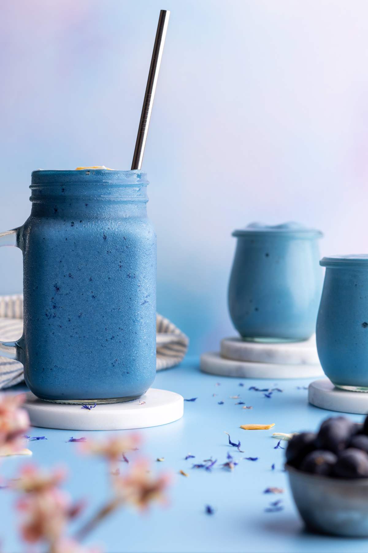 Blue spirulina smoothie jars.