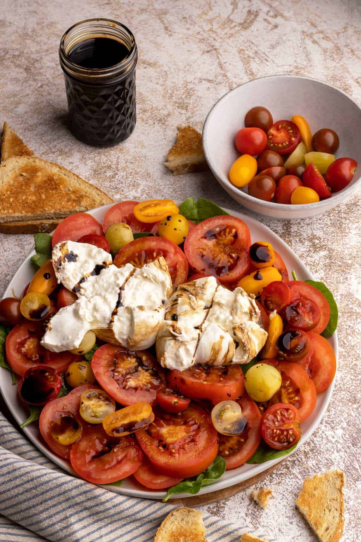 Burrata caprese salad with balsamic glaze.