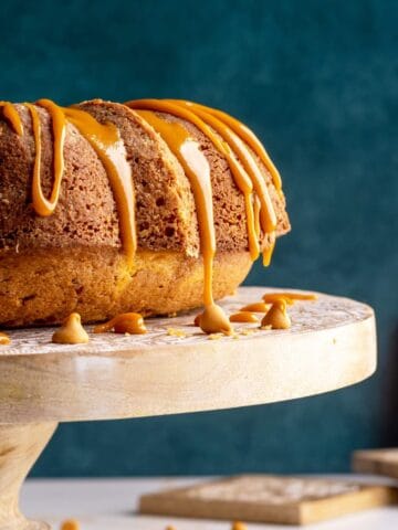 Butterscotch rum cake on a cake stand head-on shot.