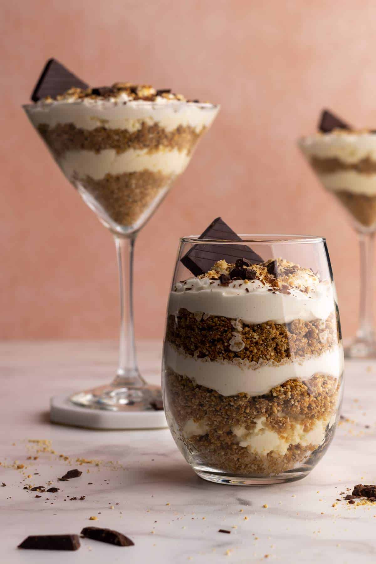Biscuit parfait layered in a small glass head-on shot.