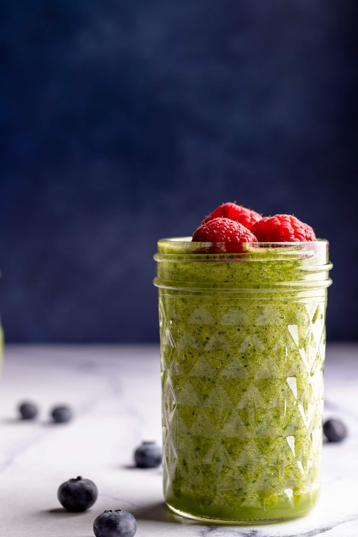 Green smoothie in a jar closeup shot.