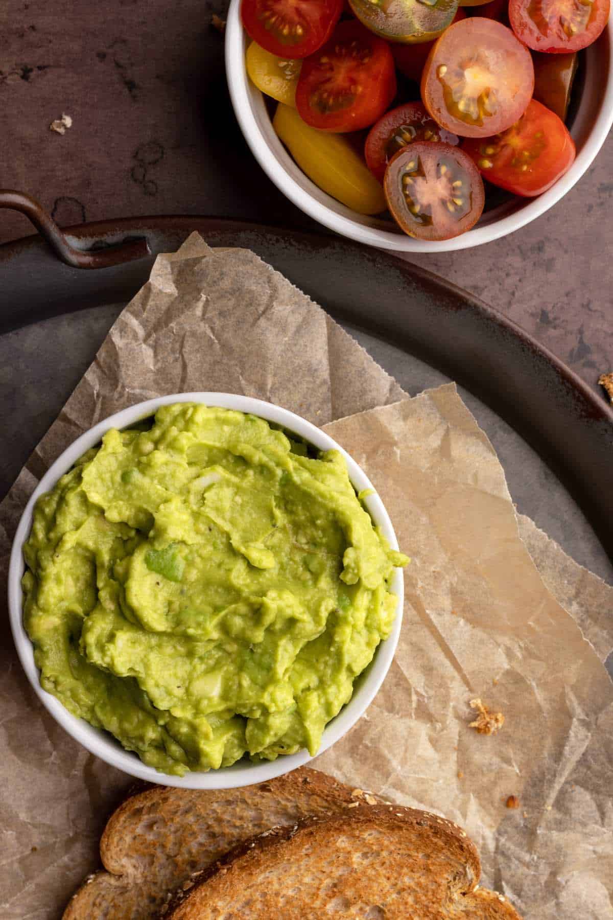 Mashed avocado in a small bowl.