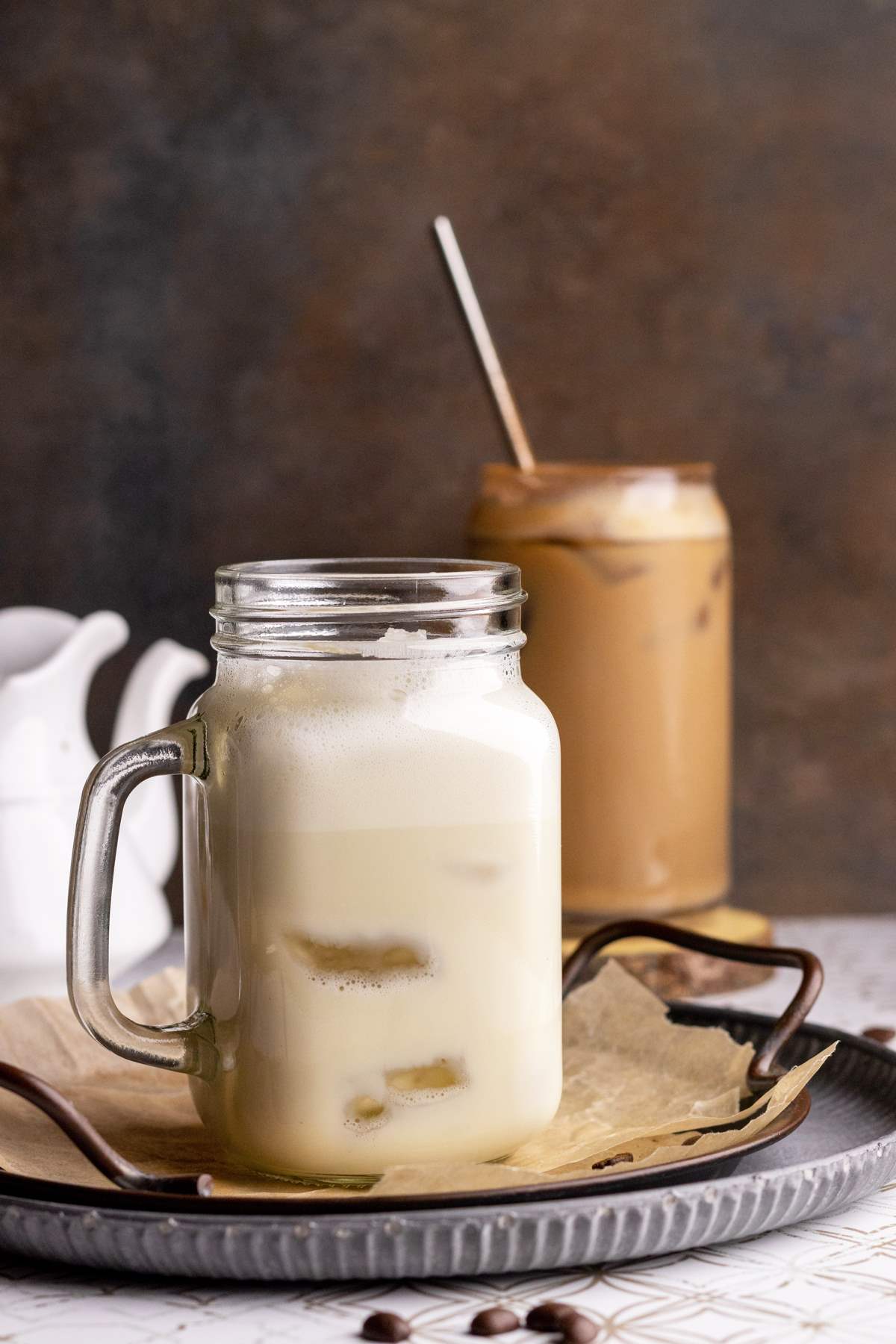 Oat milk in a jar with ice.