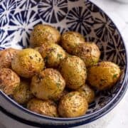 Oven roasted potatoes in a bowl close-up shot.