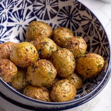 Oven roasted potatoes in a bowl close-up shot.