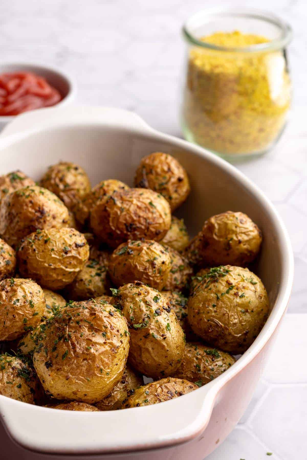 Oven roasted potatoes in a baking dish.