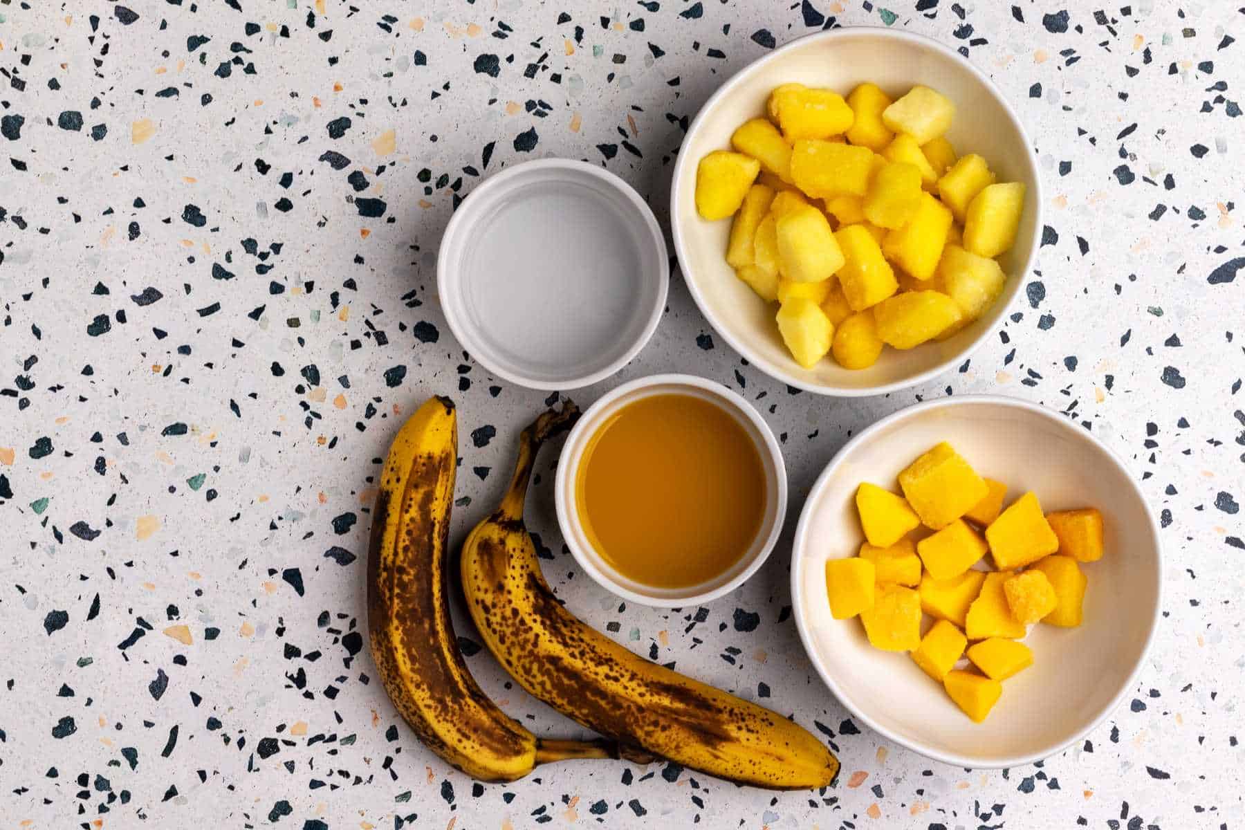 Pineapple mango smoothie ingredients.