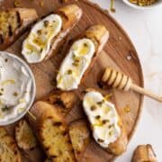 Ricotta honey toast on wooden board.