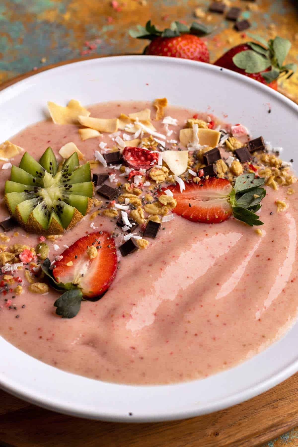 Strawberry smoothie bowl with granola and toasted coconut.