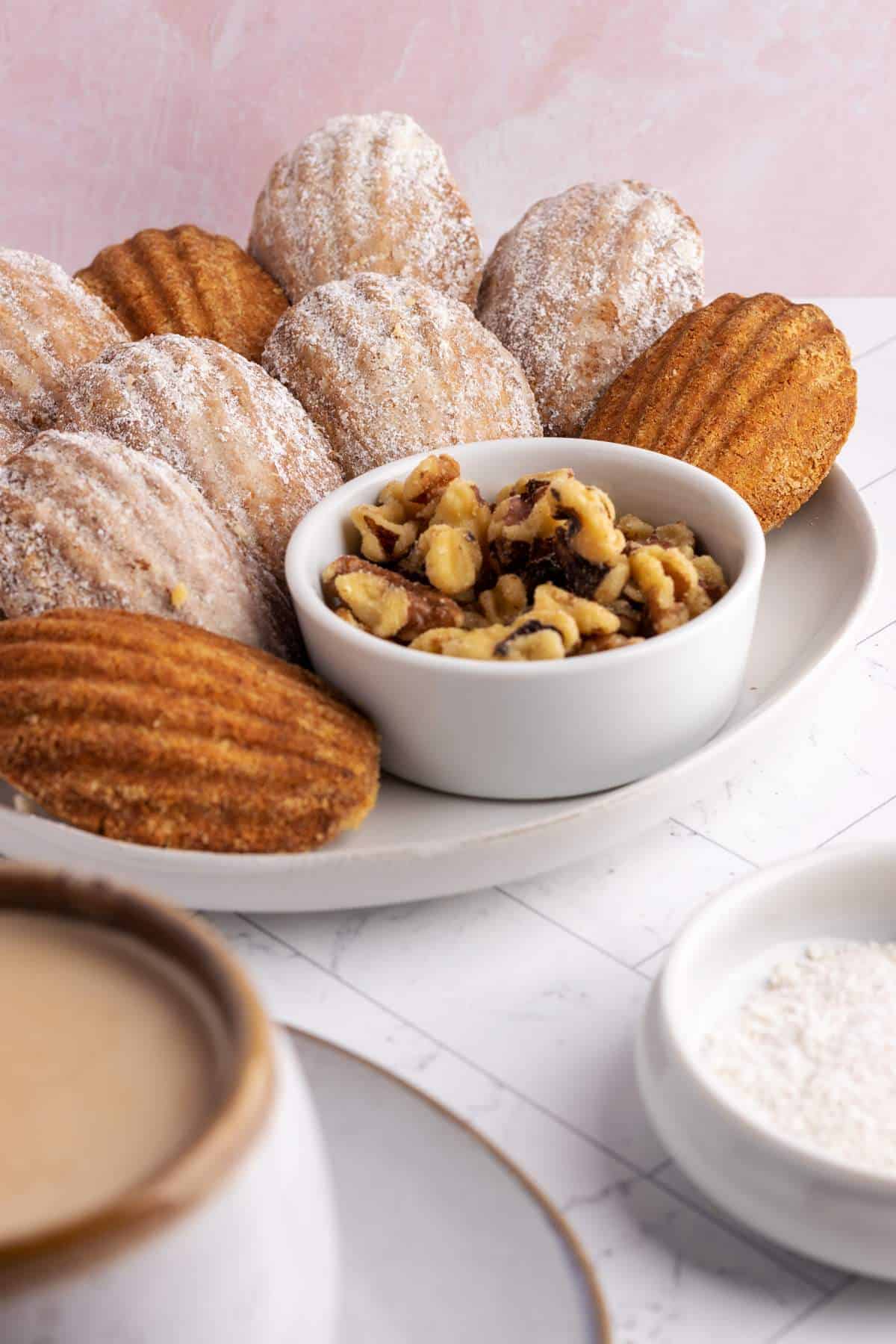 Walnut cookies on a large plate.