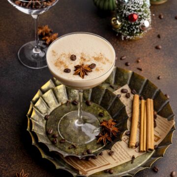 Chai espresso martini in glass on a metal tray.