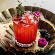 Mixed blackberry mocktail on a tray.