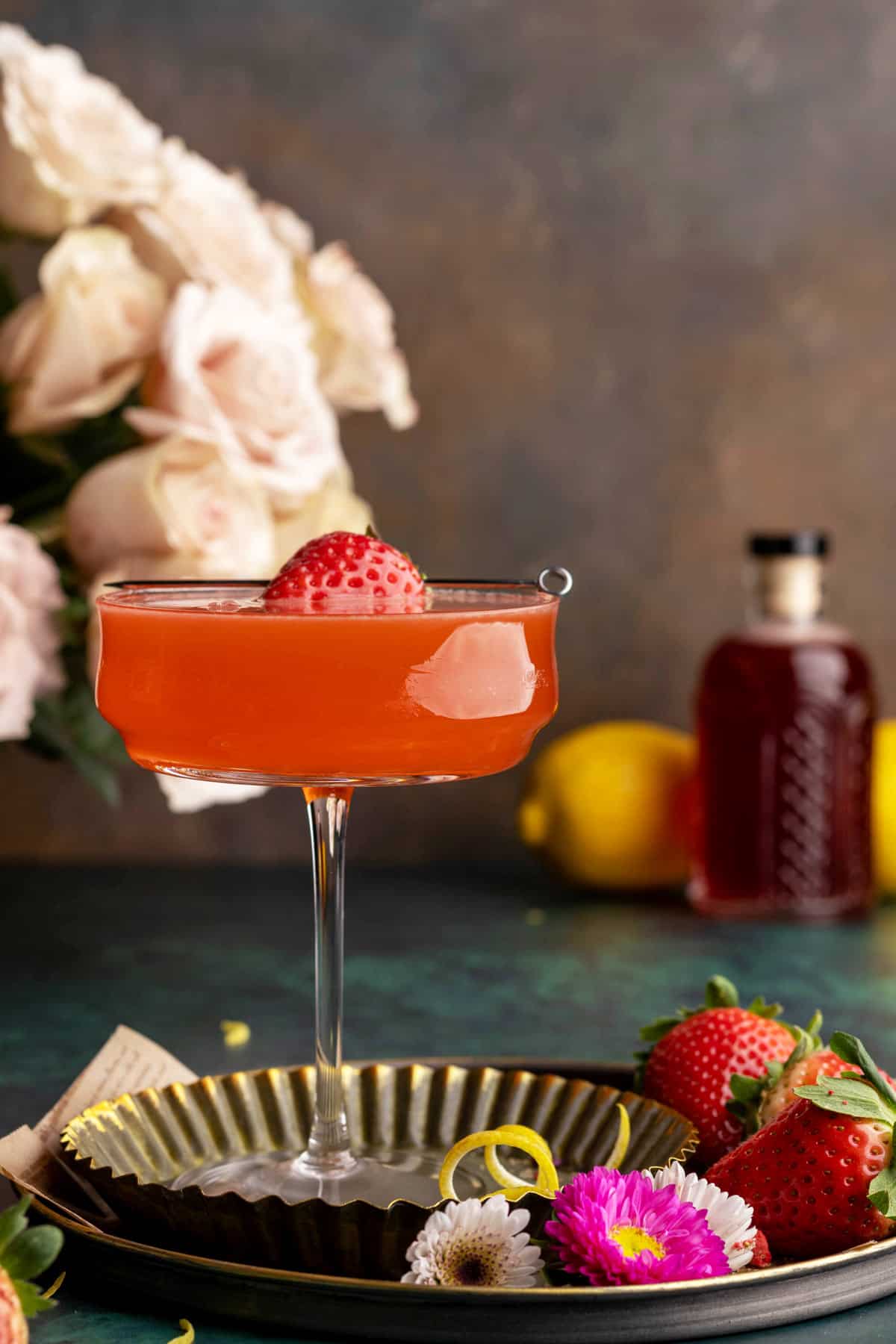 Strawberry martini with garnish.