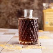 Rich demerara syrup with sugar in the background.