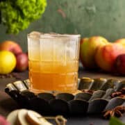 Apple cider mocktail on metal trays.