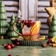 Cranberry mule mocktail with fresh cranberries.