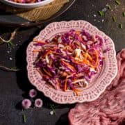 Carrot and cabbage salad on a small plate.
