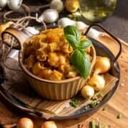 Rustic potato pasta in a bowl on a metal tray.